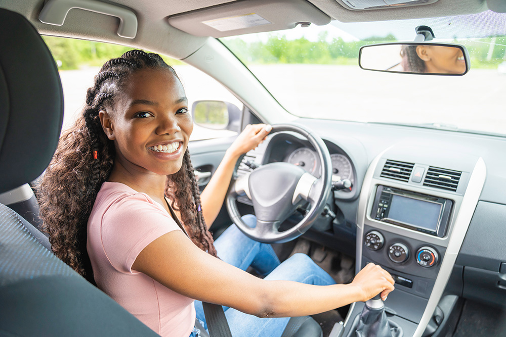 teenage girl driving a car